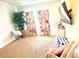 Cozy bedroom with carpet, decorative curtains, and a TV mounted on the wall at 14117 Larkspur Lake Dr, Winter Garden, FL 34787