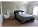 This bedroom features a brick accent wall, and natural light from the window at 14117 Larkspur Lake Dr, Winter Garden, FL 34787