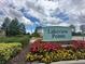 Lakeview Pointe community sign surrounded by colorful flowers and lush landscaping at 14117 Larkspur Lake Dr, Winter Garden, FL 34787