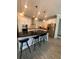 Stylish kitchen featuring white cabinets, stainless steel appliances, and a large island with bar seating at 14117 Larkspur Lake Dr, Winter Garden, FL 34787