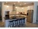 Gorgeous kitchen with stainless steel appliances, granite countertops, and center island with seating at 14117 Larkspur Lake Dr, Winter Garden, FL 34787