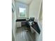 Office space featuring black granite countertop desk, white drawers, and natural light at 14117 Larkspur Lake Dr, Winter Garden, FL 34787