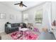 Bright bedroom filled with natural light offers space for learning, playing, and relaxing at 14215 Lakeview Park Rd, Winter Garden, FL 34787