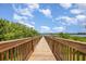 Picturesque wooden pier extending over the tranquil water, perfect for leisurely strolls at 14215 Lakeview Park Rd, Winter Garden, FL 34787