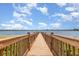 Beautiful wooden dock stretches into the lake, ideal for scenic views and nature walks at 14215 Lakeview Park Rd, Winter Garden, FL 34787