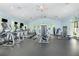Spacious gym with treadmills, weight machines, and large windows for a bright and motivating workout environment at 14215 Lakeview Park Rd, Winter Garden, FL 34787