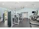 Well-equipped fitness center featuring modern exercise machines, ceiling fans, and ample natural light at 14215 Lakeview Park Rd, Winter Garden, FL 34787