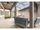 Relaxing covered patio with comfortable seating and a summer kitchen with a built-in grill at 14215 Lakeview Park Rd, Winter Garden, FL 34787