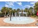 Fun splash pad with interactive fountains and lounge chairs offers a refreshing outdoor experience at 14215 Lakeview Park Rd, Winter Garden, FL 34787
