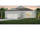 Charming single-Gathering home with a two-car garage, manicured lawn, and beautiful landscaping at 1553 Groveline Rd, St Cloud, FL 34771