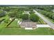 Sprawling property with a pool, RV, additional storage, and a large, meticulously maintained lawn at 15650 Catherine Cir, Groveland, FL 34736
