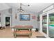 Cozy dining area with a rustic wooden table and bench, with decor touches throughout at 15650 Catherine Cir, Groveland, FL 34736