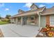 Charming home with a covered front porch, shuttered windows, and lush landscaping at 15650 Catherine Cir, Groveland, FL 34736