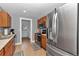 Traditional kitchen features wood cabinets, stainless appliances and tile flooring at 15650 Catherine Cir, Groveland, FL 34736
