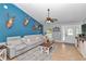 Bright living room with a comfortable seating area and a decorative accent wall at 15650 Catherine Cir, Groveland, FL 34736