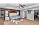 Spacious main bedroom with wood accent wall and a view into the ensuite bath at 15650 Catherine Cir, Groveland, FL 34736