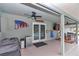 Covered patio with ceiling fan and outdoor seating, perfect for entertaining or relaxation at 15650 Catherine Cir, Groveland, FL 34736