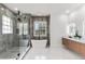 Modern bathroom featuring a soaking tub, glass shower, and double vanity at 1700 Shandwick Ct, Longwood, FL 32779