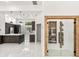 Modern kitchen with stainless steel appliances, island and wine storage at 1700 Shandwick Ct, Longwood, FL 32779