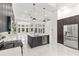 Kitchen island view of the open-concept floor plan, leading to the living area and backyard pool at 1700 Shandwick Ct, Longwood, FL 32779