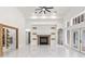 Bright living room with fireplace, wine storage, high ceilings, and white tile flooring at 1700 Shandwick Ct, Longwood, FL 32779