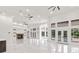 Expansive living room with abundant natural light, modern fireplace, and views of the backyard pool at 1700 Shandwick Ct, Longwood, FL 32779