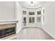 Spacious living room with fireplace, hardwood floors and plenty of natural light at 1700 Shandwick Ct, Longwood, FL 32779