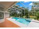 Sparkling swimming pool with attached hot tub and screened in enclosure at 1700 Shandwick Ct, Longwood, FL 32779