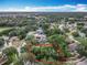 Expansive aerial view of a vacant lot surrounded by lush trees in a thriving neighborhood at 1701 Lucky Pennie Way, Apopka, FL 32712