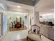 The spacious dining area is open to the living area of the home and features a chandelier and hardwood floors at 1701 Lucky Pennie Way, Apopka, FL 32712