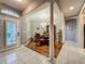 Formal dining room featuring elegant chandelier, rich wood floors, and neutral decor at 1701 Lucky Pennie Way, Apopka, FL 32712