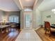 Inviting home foyer showcasing tile flooring, high ceilings, and ample natural light at 1701 Lucky Pennie Way, Apopka, FL 32712