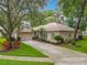 Charming home with a well-manicured lawn and mature trees, offering great curb appeal at 1701 Lucky Pennie Way, Apopka, FL 32712