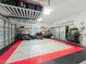 Spacious garage with ample storage options and a well-organized layout for tools and equipment at 1701 Lucky Pennie Way, Apopka, FL 32712