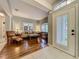 Bright living room with wood floors, plantation shutters, and elegant furnishings at 1701 Lucky Pennie Way, Apopka, FL 32712