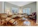 Elegant living room with hardwood floors, and lots of natural light at 1701 Lucky Pennie Way, Apopka, FL 32712