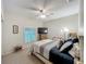 Relaxing bedroom with a ceiling fan, shutters, a TV, and neutral walls, perfect for unwinding at 1701 Lucky Pennie Way, Apopka, FL 32712