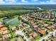 Beautiful aerial view of neighborhood with lush landscaping, lake and access to the river at 172 Verde Way, Debary, FL 32713