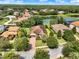 A beautiful aerial image of the house with well-maintained lawn and tropical landscaping at 172 Verde Way, Debary, FL 32713