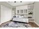 Cozy bedroom featuring hardwood floors and custom built-in shelving at 172 Verde Way, Debary, FL 32713