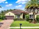 Charming single-story home boasts a well-manicured lawn, a tiled roof, and mature landscaping at 172 Verde Way, Debary, FL 32713