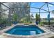 Stunning hot tub on a screened patio overlooking lush greenery and serene lake views at 172 Verde Way, Debary, FL 32713