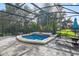 Inviting hot tub on a large screened patio, perfect for relaxing and enjoying the lake view at 172 Verde Way, Debary, FL 32713