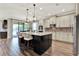 Open kitchen with stainless steel appliances, center island, granite counters, and bar seating at 172 Verde Way, Debary, FL 32713