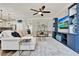 Cozy living room featuring a comfortable sofa, modern entertainment center, and stylish rug at 172 Verde Way, Debary, FL 32713