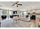 Spacious living room and kitchen area with wood floors, a large island, and ample seating at 172 Verde Way, Debary, FL 32713