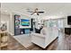 Spacious living room with hardwood floors, custom cabinets, and comfortable seating at 172 Verde Way, Debary, FL 32713