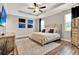 Comfortable main bedroom with tray ceiling, stylish decor, and ensuite bathroom at 172 Verde Way, Debary, FL 32713