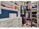 Well-organized walk-in closet featuring custom shelving and storage solutions at 172 Verde Way, Debary, FL 32713