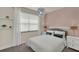 Cozy bedroom featuring soft textures, natural light, and a soothing color scheme at 17441 Hidden Forest Dr, Clermont, FL 34714